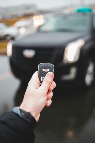 Person Holding Car Key